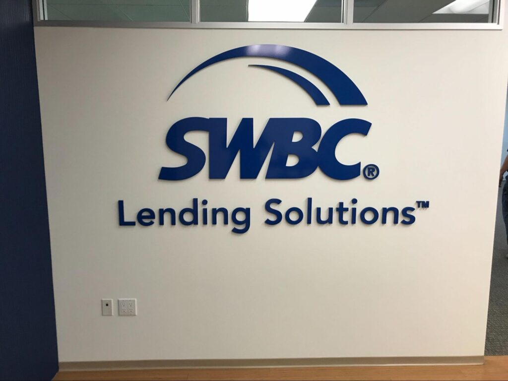 blue SWBC Lending Solutions wall sign