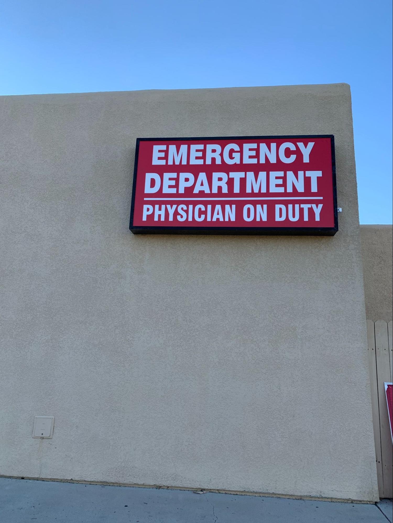 a red and white emergency department box sign.